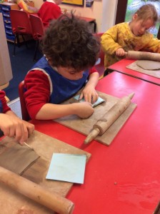 the carefully moulded the clay into their chosen shape.