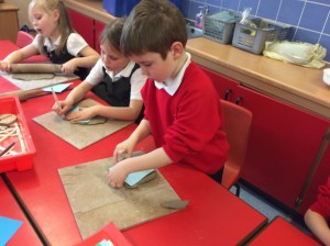 The children have made clay pots and tiles.
