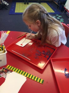 They used pipettes to drop paint onto paper and then used a straw to blow the paint across the paper. They were very effective.